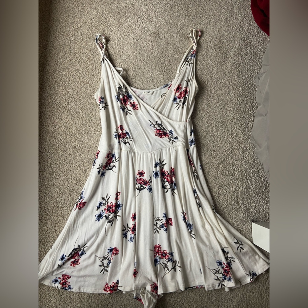 White floral romper with adjustable straps